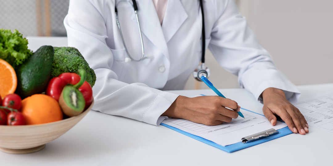 doctor writing a referral.